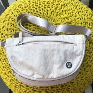 lululemon athletica ivory/ silver hardware crossbody bag